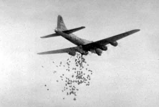 A bomber of the 390th dropping it's precious cargo over Holland. Picture courtesy, Dennis Van Wey